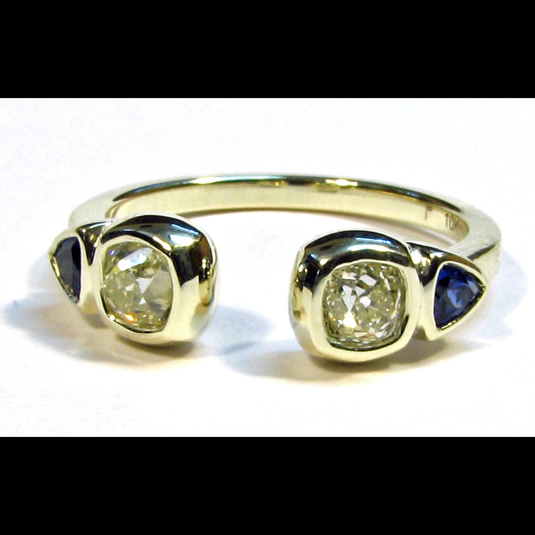 Ring with antique diamonds and sapphire trillions