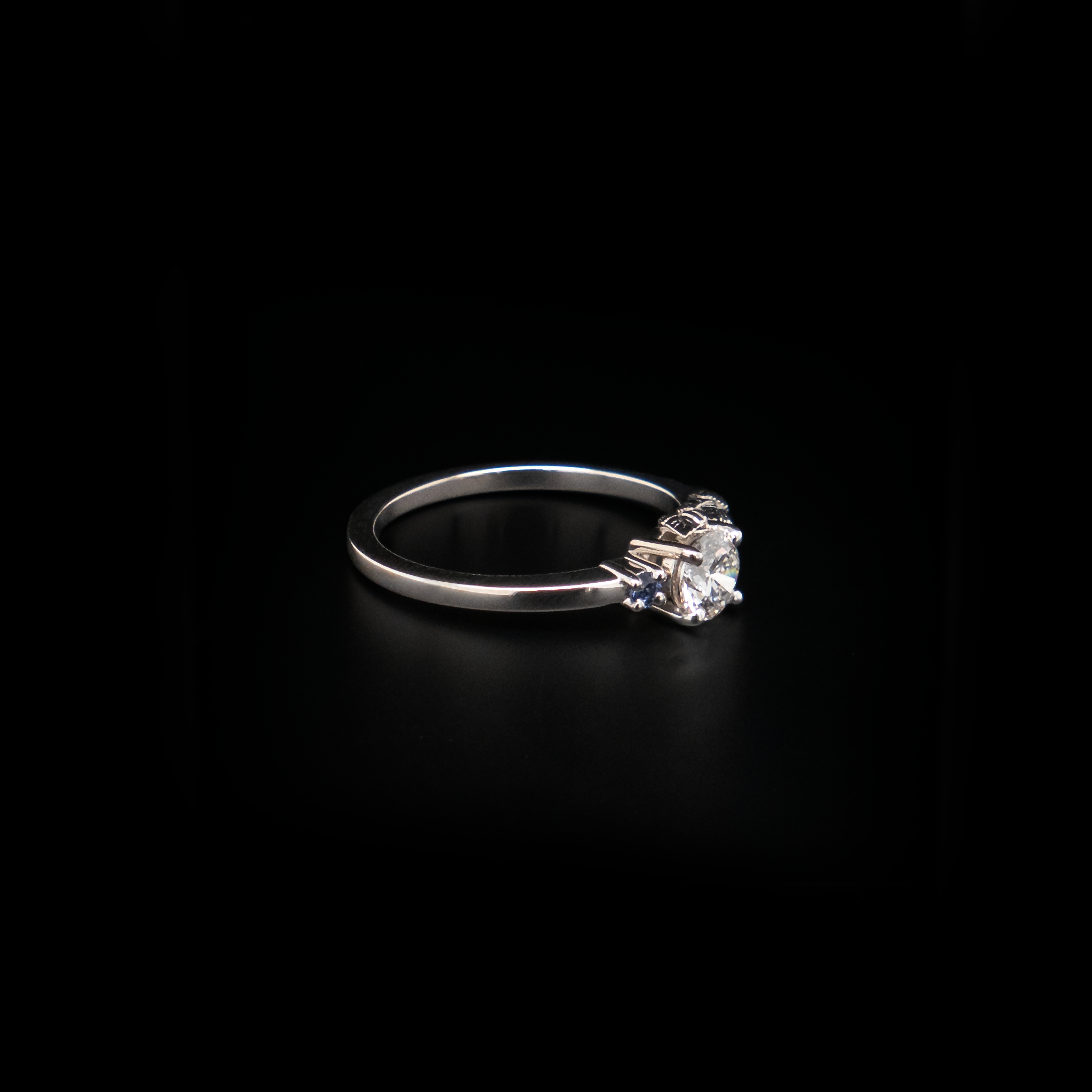 Half Carat diamond ring with small sapphires and leaves