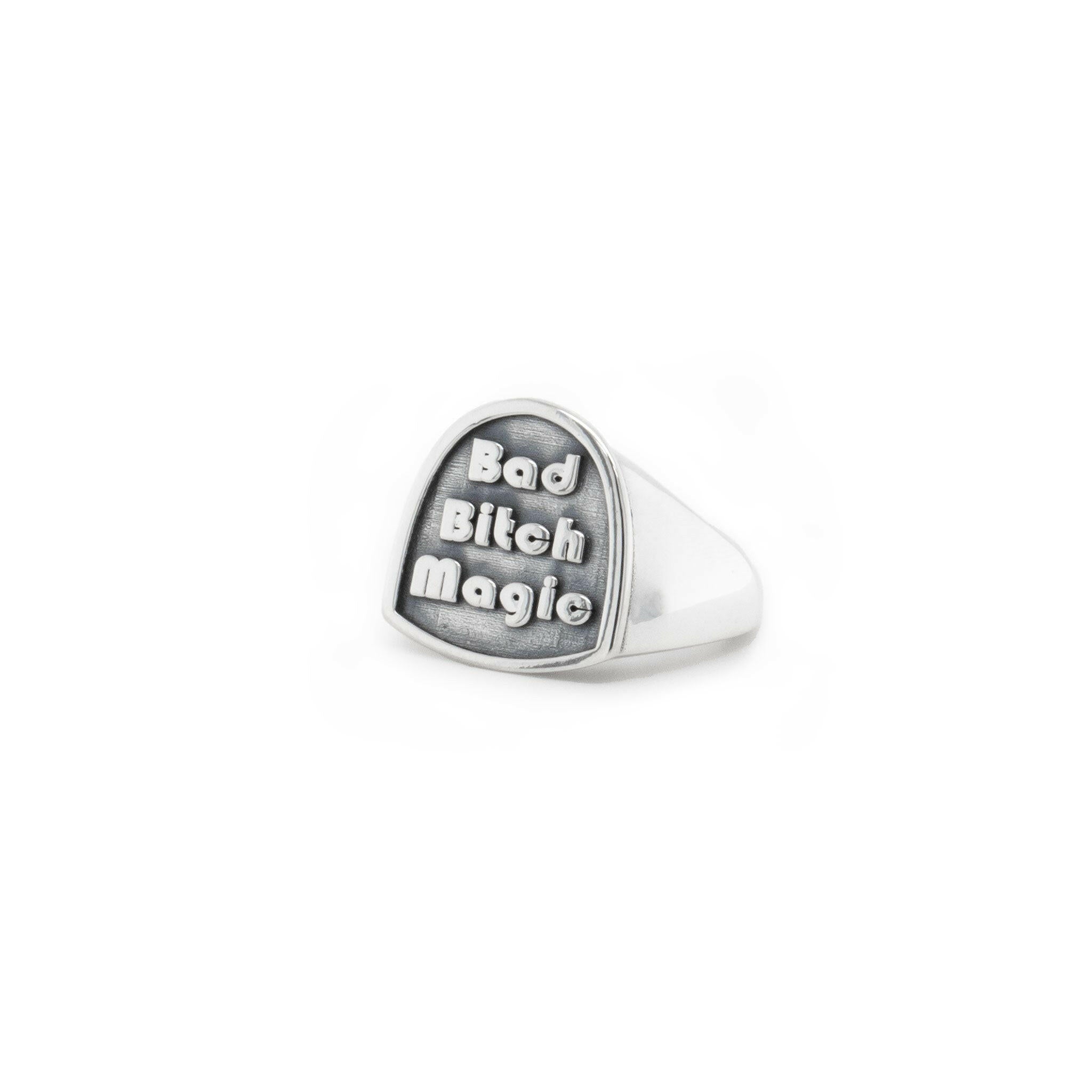 front right angle view of sterling silver ring that reads "bad bitch magic'