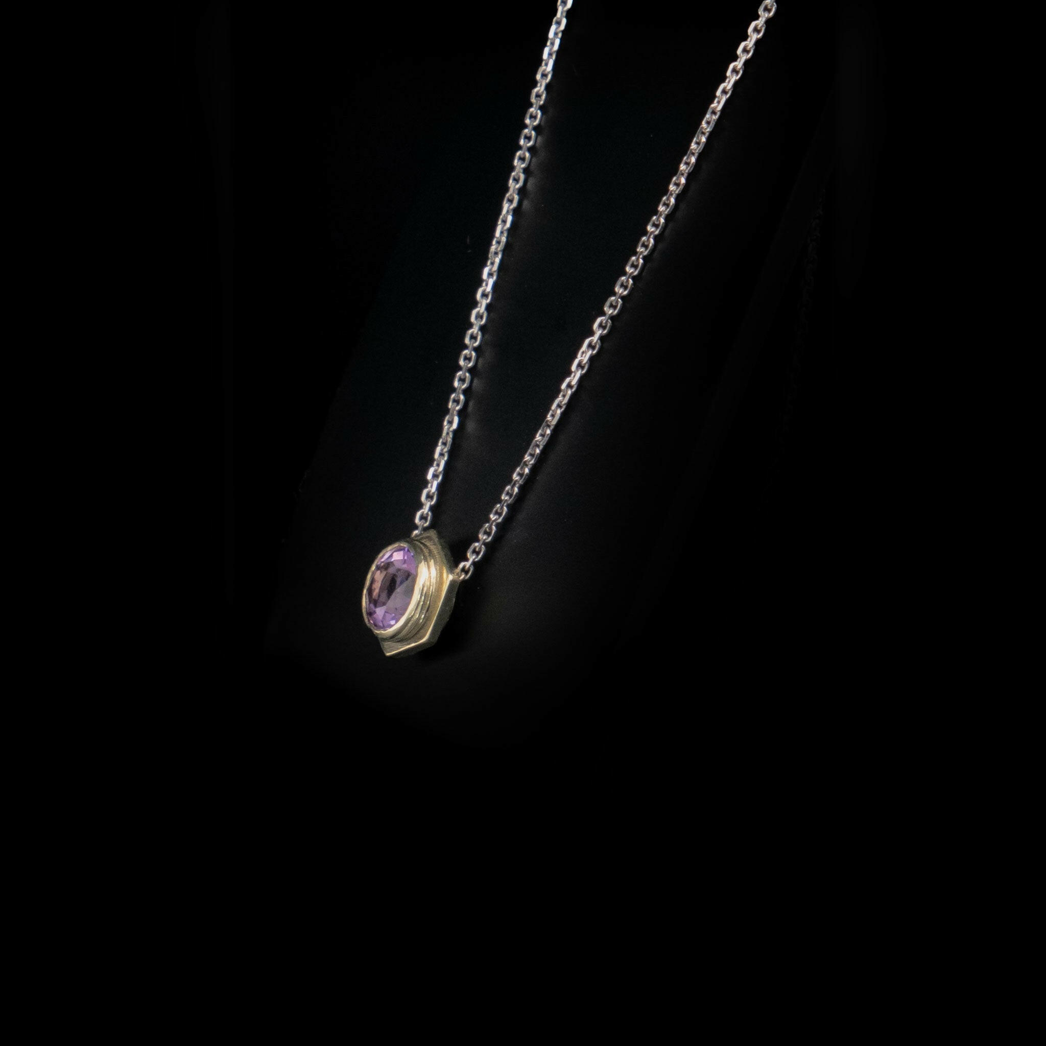 side view of bolt pendant necklace with amethyst , white gold chain and bail