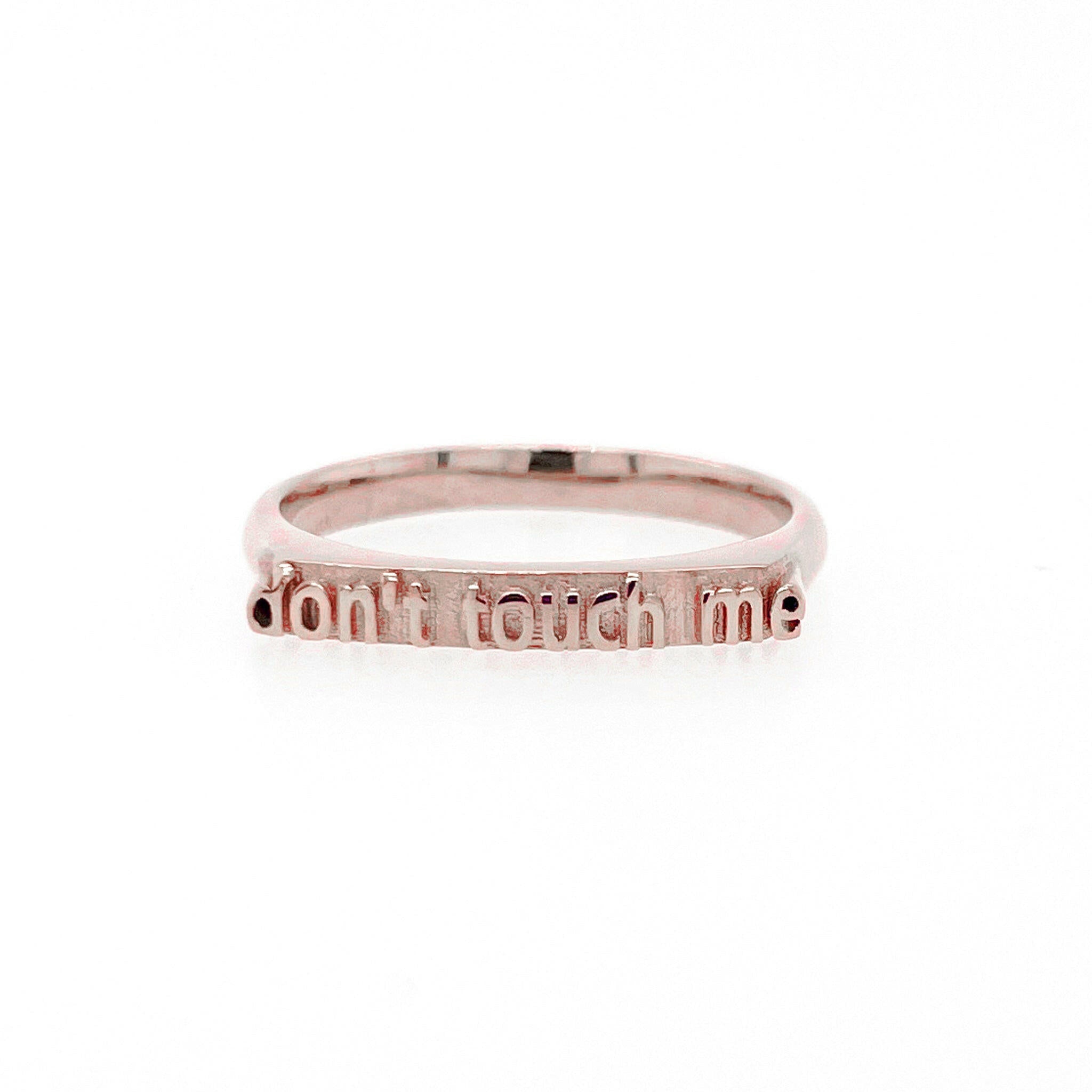 front view of 14 karat rose gold ring with text that reads "don't touch me"